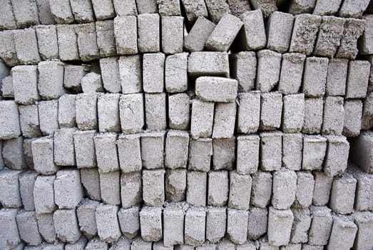 Stack of gray bricks. Abstract textured background.