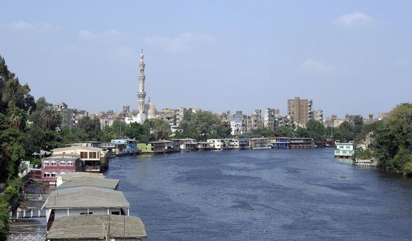 View of Cairo. River, houses, minaret tower.