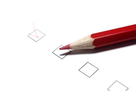 Red pencil and checkboxes isolated on white background.