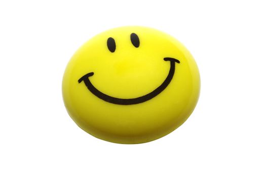 Yellow smiling magnet isolated on white background.