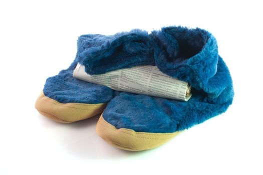 A pair of warm cosy slippers with newspaper