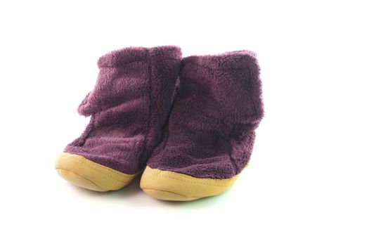 A pair of warm cosy slippers on isolated background