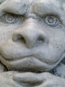 Gargoyle statue taken with emphasis on face and eyes