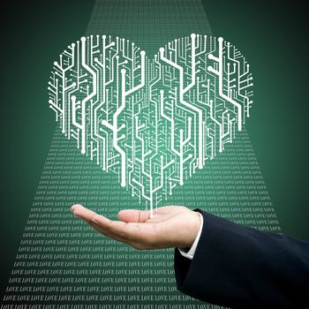 Businessman carry the Circuit board in heart shape, Technology background 