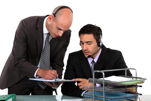 Office workers wearing headsets