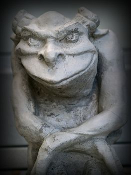 Gargoyle Statue Emphasis on Face and Eyes with a Dark Border