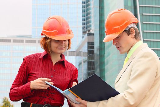 Business man and the woman discuss the project