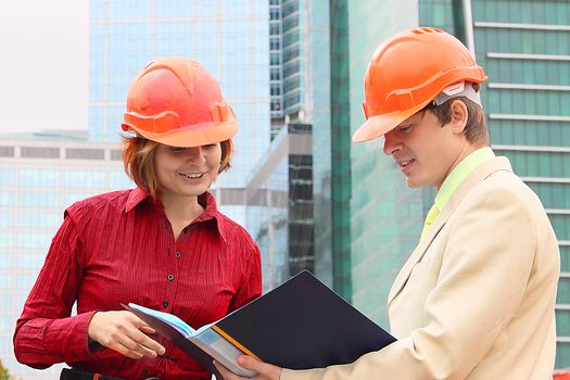 Business man and the woman discuss the project