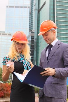 Business man and the woman discuss the project