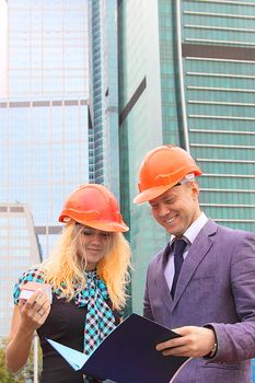 Business man and the woman discuss the project