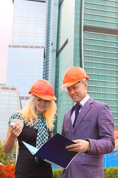 Business man and the woman discuss the project
