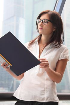 Portrait of the beautiful and young business woman