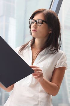 Portrait of the beautiful and young business woman