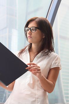 Portrait of the beautiful and young business woman