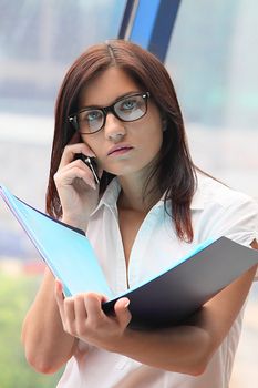 Portrait of the beautiful and young business woman