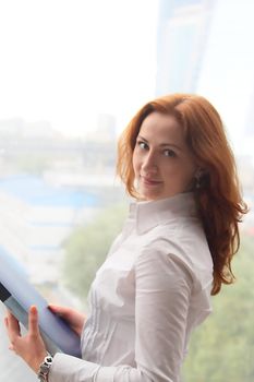 Portrait of the beautiful and young business woman