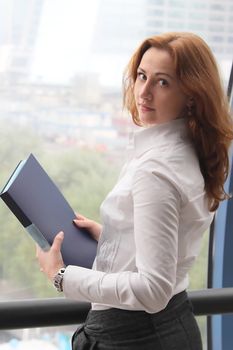 Portrait of the beautiful and young business woman