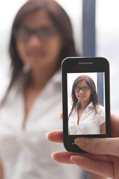The girl photograph on a mobile phone