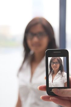 The girl photograph on a mobile phone