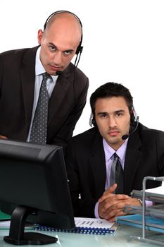 Executives with headphones and microphone