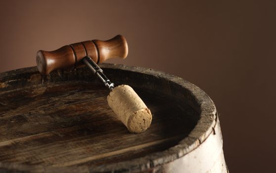 corkscrew and wooden barrel
