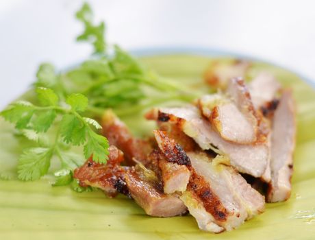 a delicious sliced grilled pork  served with vegetables