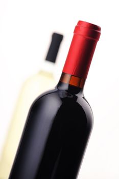 bottles of red and white wine on white background