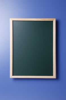 Stock image of blackboard isolated on the blue background.