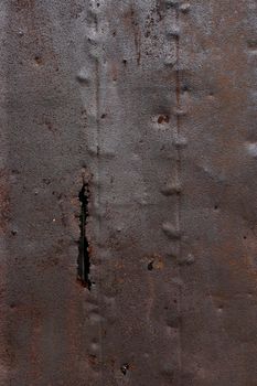 Photo of a corroded and rusty metal background.