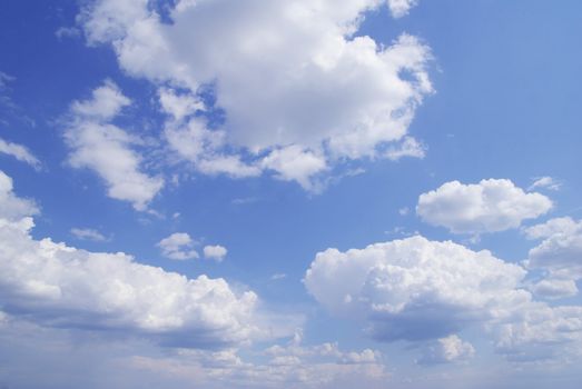 Blue sky background with tiny clouds