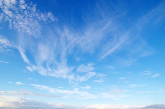 blue sky background with tiny clouds