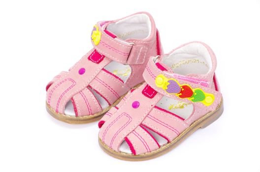 pink child's sandals isolated on white