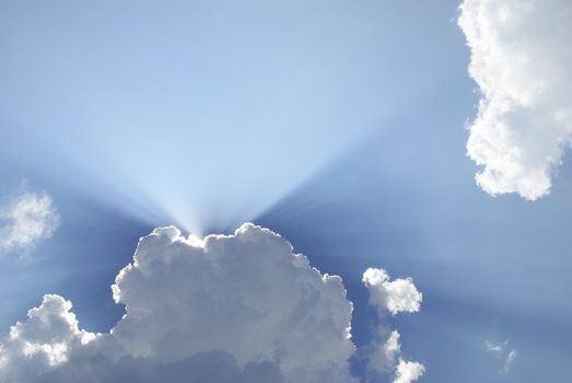 Blue sky with clouds and sun