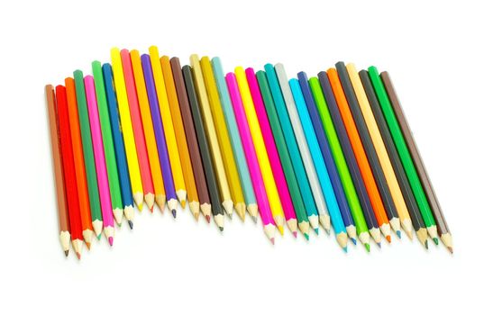  Assortment of coloured pencils  on white background