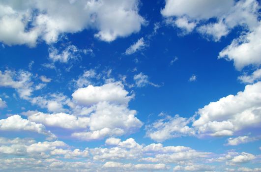 blue sky background with tiny clouds
