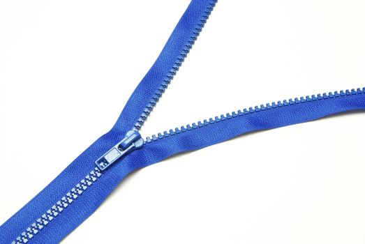Unzipped blue metal zipper on white background