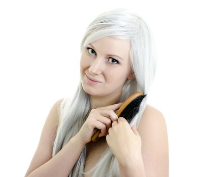 portrait of young smiling girl brushing hair isolated on white