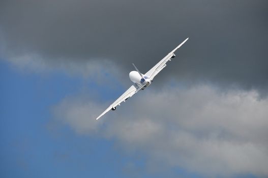 A white airliner in the sky after take-off