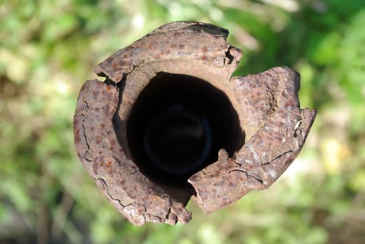 Rusty metal pipe with a flattened end face