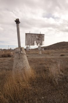 abandoned movie theater int he desert with clouds