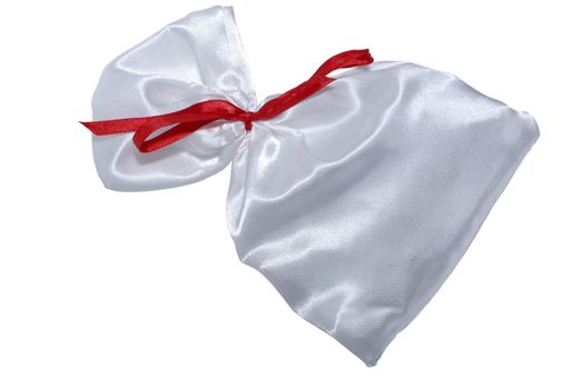 Silk bag for gifts with red ribbon. Isolated on white background. Clipping path.