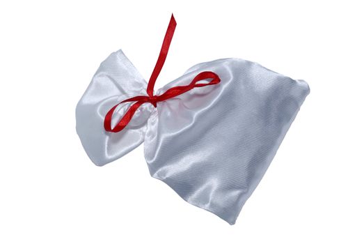 White silk bag for gifts with red ribbon. Isolated on white. Clipping path.