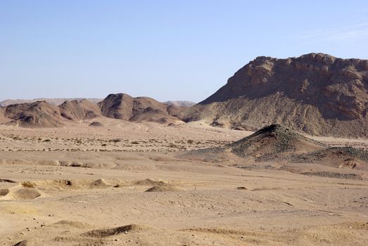 Egyptian desert with mountains background.