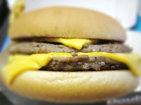 close up for a delicious double cheese burger, fast food