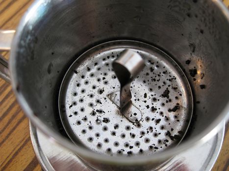 close-up for a vietnam style brewer with coffee grounds