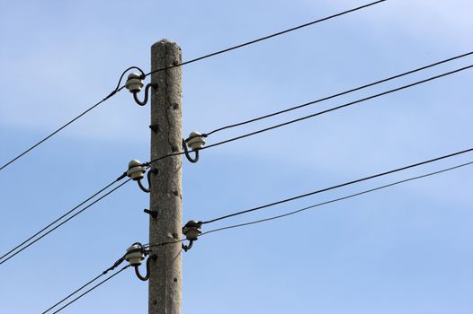 A distribution line over blue sky