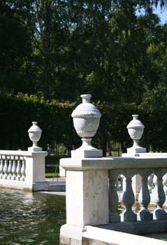 three marble vases in the park
