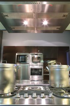 fragment of interiors of modern kitchen with gas fryer