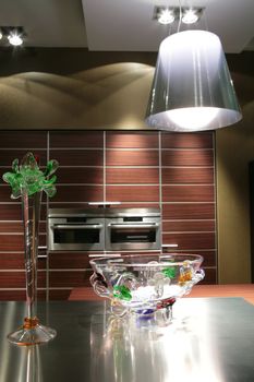 interior to modern kitchen in brown tone with glass vase and lampshade