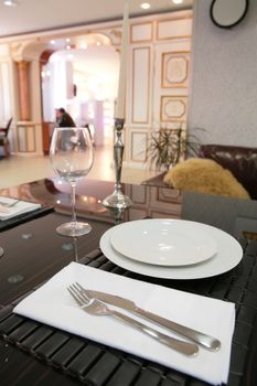 dinning-room in classical style with white plate and candle